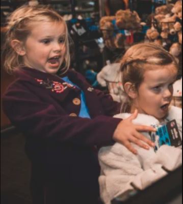 Vivienne Rhule with younger sister Leona Rhule at Panthers